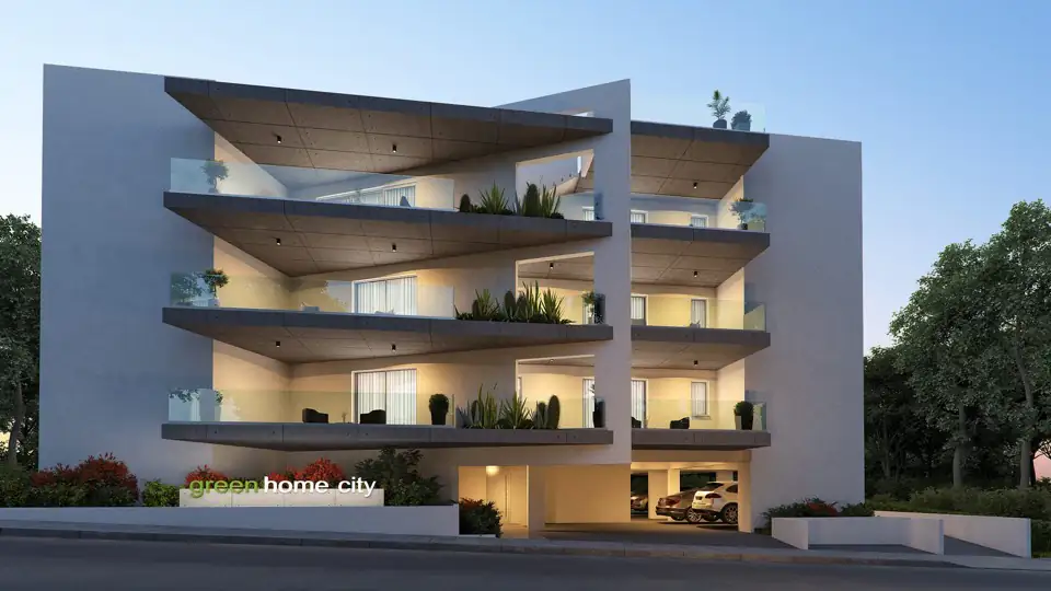 Dusk render of a block with deep shelf-like balconies densely planted along every level