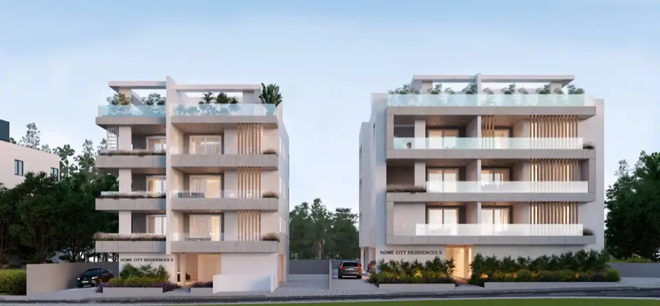 Render of two white low-rise apartment blocks at dusk with planted roof terraces